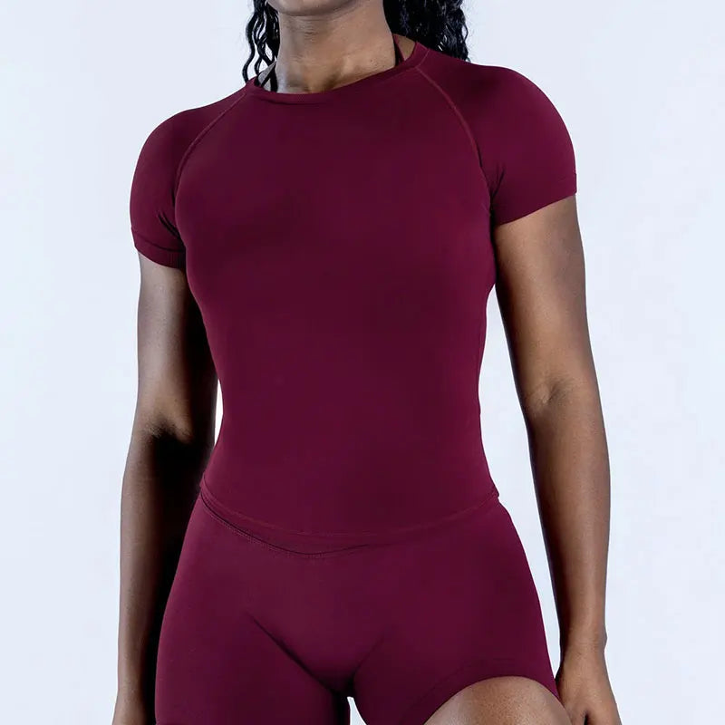 A maroon seamless high-waist yoga set for women shown on a model.