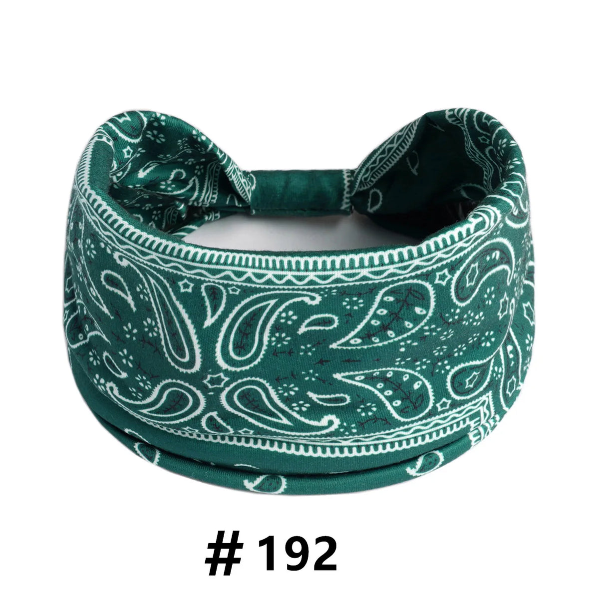 A dark green boho print cotton headband with a bow detail.