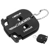 Black portable golf score counter with a key ring attached