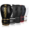 A set of black and gold boxing training gloves stacked in a row.