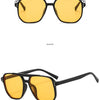 Black-yellow vintage square sunglasses shown from the front and side views.