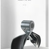 A silver pelvic muscle trainer device is shown in a close-up, resting on a white surface.