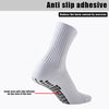 White athletic grip socks with anti-slip silicone on the sole of the foot