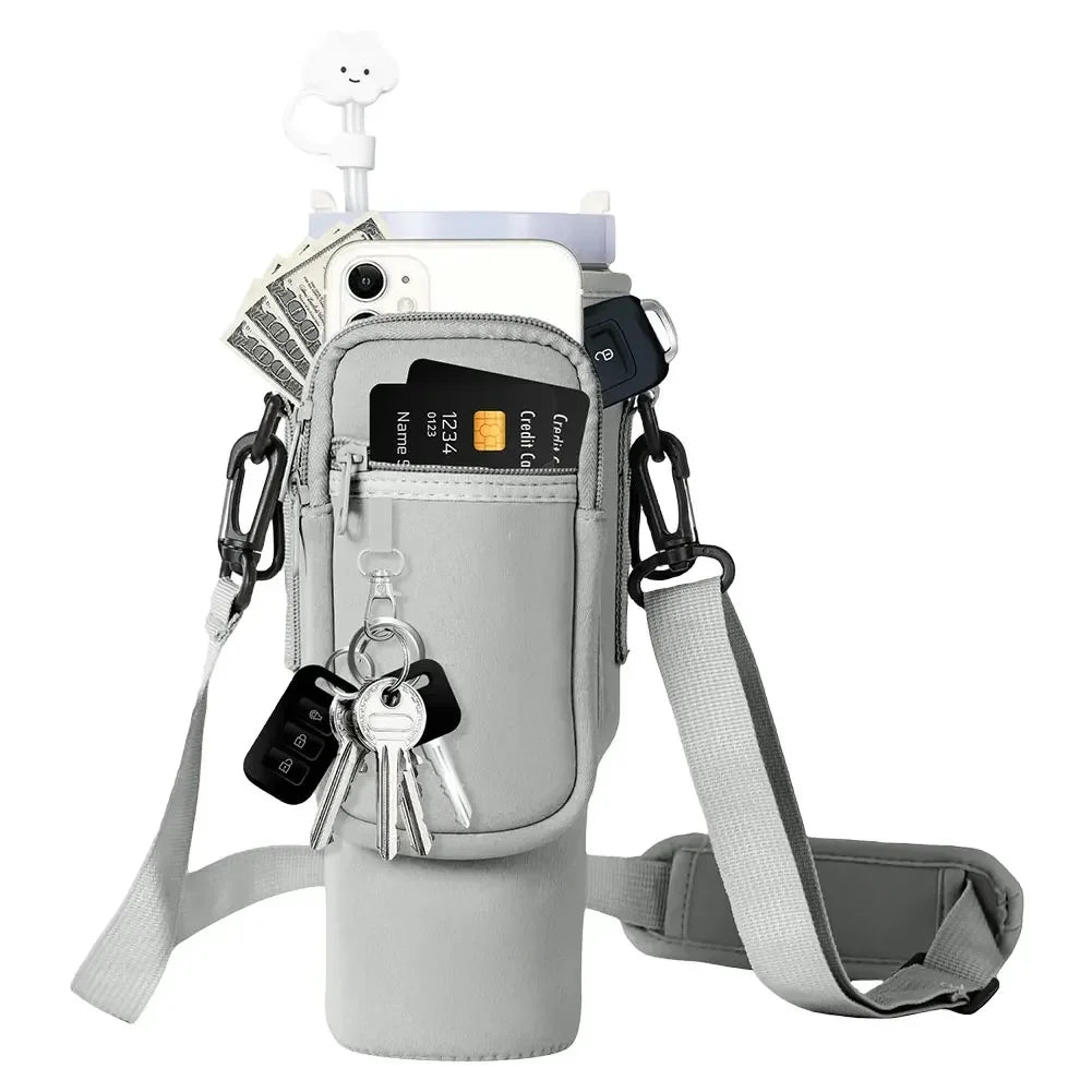A gray neoprene water bottle carrier bag with a shoulder strap and various tools attached.