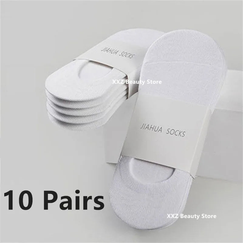 A stack of ten pairs of white Jiahua socks displayed on a white box.