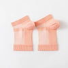 Pair of light peach therapeutic compression socks for foot and ankle pain relief