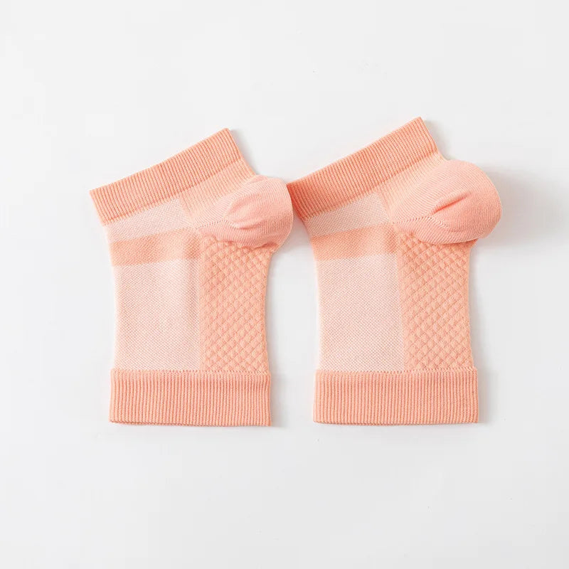 Pair of light peach therapeutic compression socks for foot and ankle pain relief