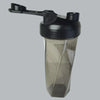 A clear plastic protein shaker bottle with a black lid and a black straw attachment.