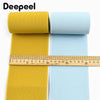 Yellow and light blue elastic bands rolled up for sewing and decoration