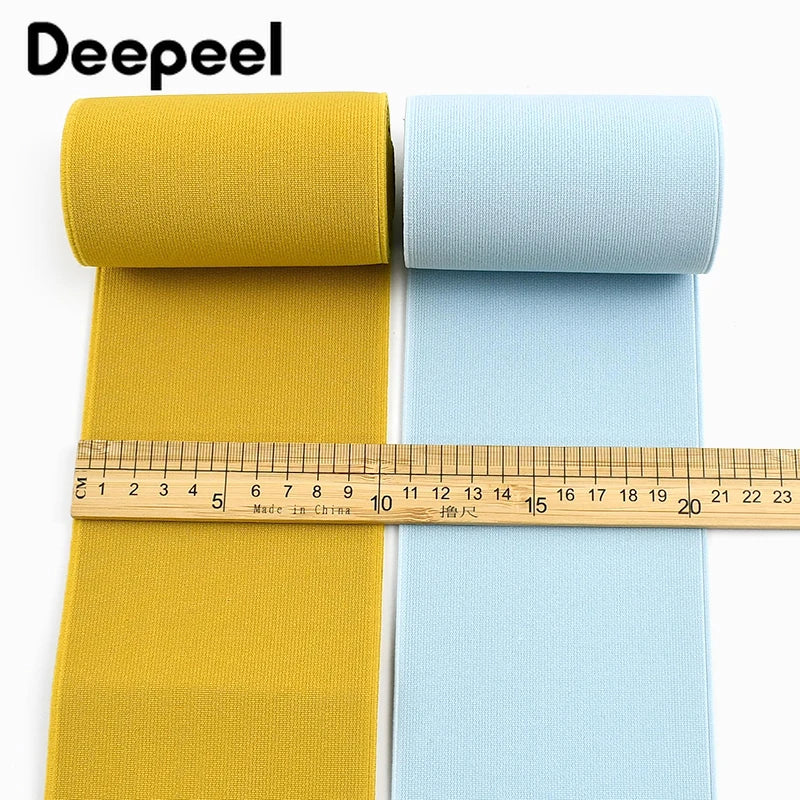 Yellow and light blue elastic bands rolled up for sewing and decoration
