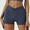 A model wearing dark blue high-waisted yoga and fitness leggings.