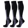 A pair of black compression socks with gray accents shown vertically.