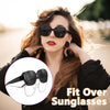 A woman models black sunglasses and glasses compatibility for fit over sunglasses.