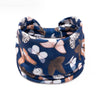 A navy blue floral butterfly patterned headband worn around the head.