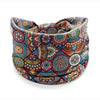 A colorful bohemian stretch cotton headband featuring intricate geometric and floral patterns.