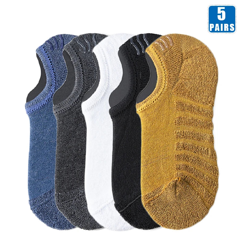 Five pairs of men's cotton crew socks in various colors including blue, gray, white, black, and mustard yellow.