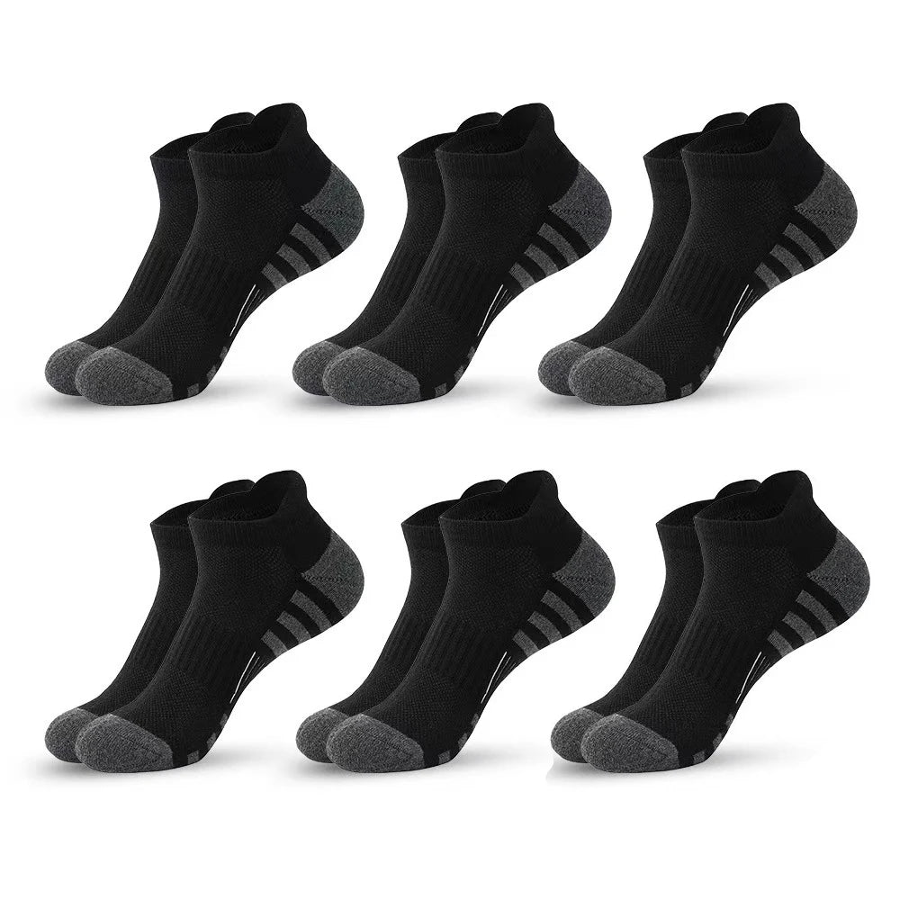 A set of black athletic running socks for men and women displayed in various angles.
