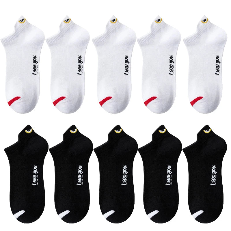 A set of ten white and black breathable ankle boat socks displayed in various angles.