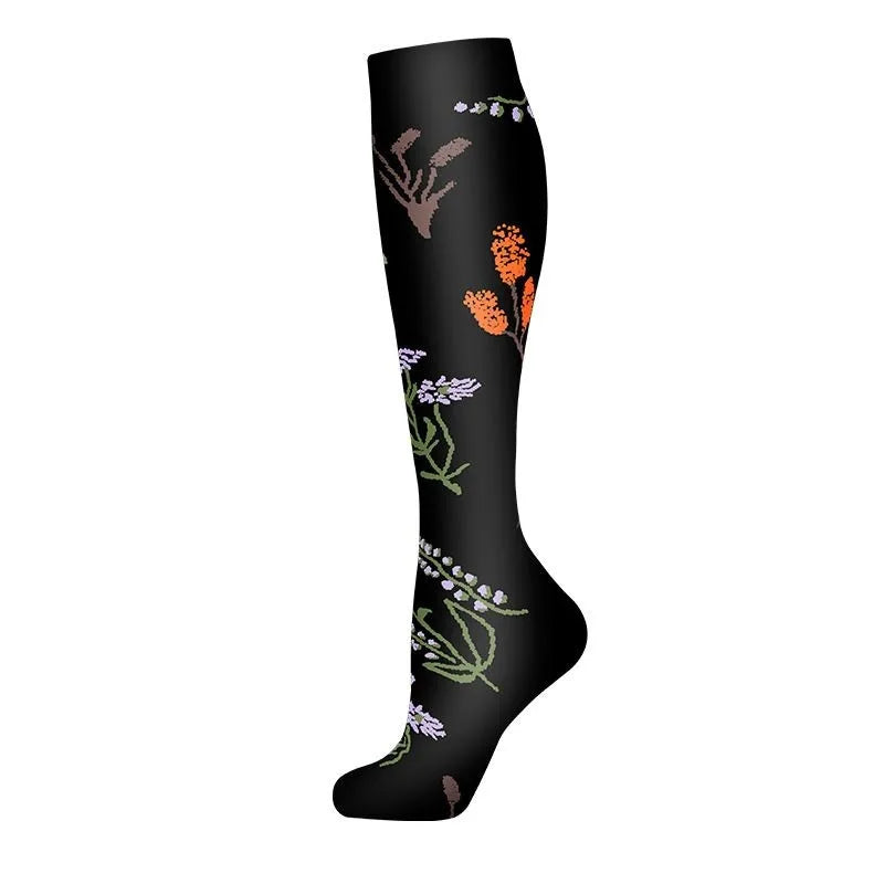 Black compression socks featuring a floral pattern of various dried plant elements.