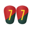 A pair of red and green mini football shin guards for youth and adult players.