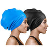 A woman is shown wearing a blue silicone swim cap and a black silicone swim cap.