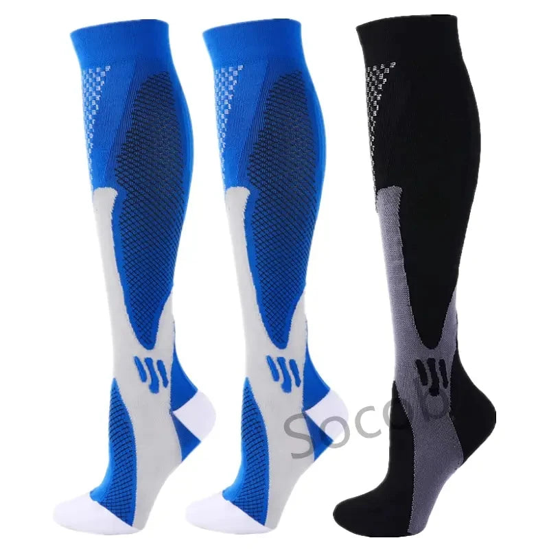 A set of three compression socks in blue, gray, and black for athletes and medical use.
