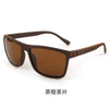 Brown sunglasses with a dark brown frame and lens, shown against a white background.