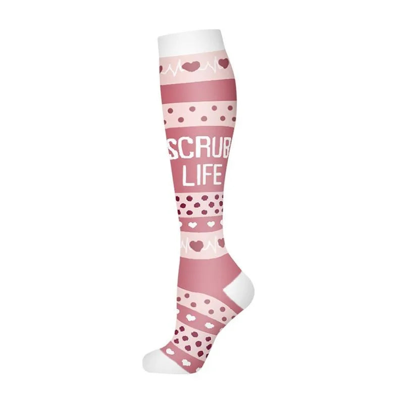 A pair of pink compression socks with a scrub life pattern.