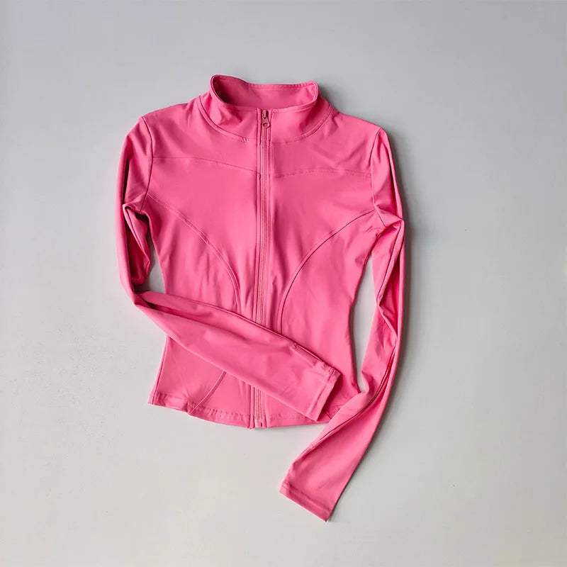 A bright pink long-sleeved zip-up jacket for yoga and fitness.