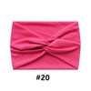 A folded pink fabric item, likely a boho wide turban headband, shown flat.