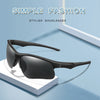 A pair of black sunglasses is displayed on a white surface with a soft shadow, emphasizing simple fashion.