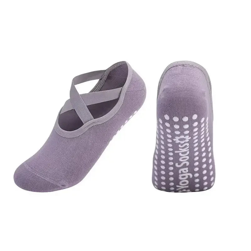 A pair of purple silicone anti-slip pilates and yoga socks shown from the side.