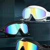 A display of multiple colored high-definition anti-fog swimming goggles shown in various angles.