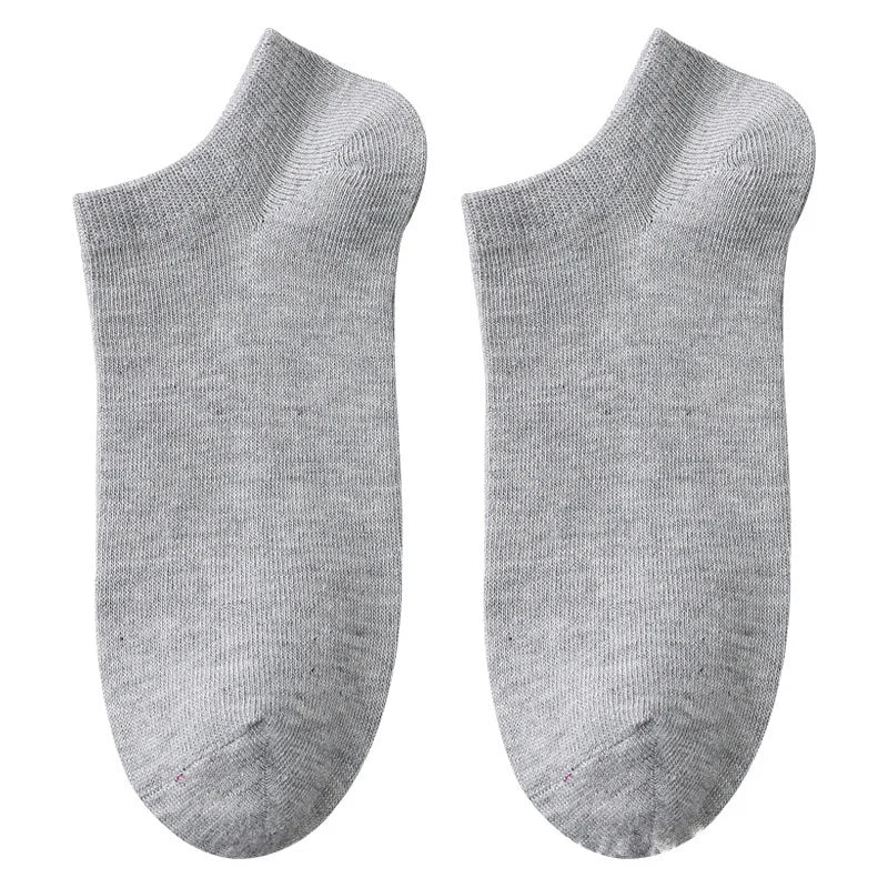 A pair of light gray breathable men's sports ankle socks shown from the side.