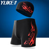 Black men's swim suit with goggles, cap, and earplugs featuring red flame graphics.