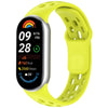 A yellow Breathable TPU smart watch band replacement with a black digital display showing time and activity data.