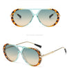 Cyan Hawksbill/Cyan Yellow sunglasses with tortoiseshell frames and tinted lenses.
