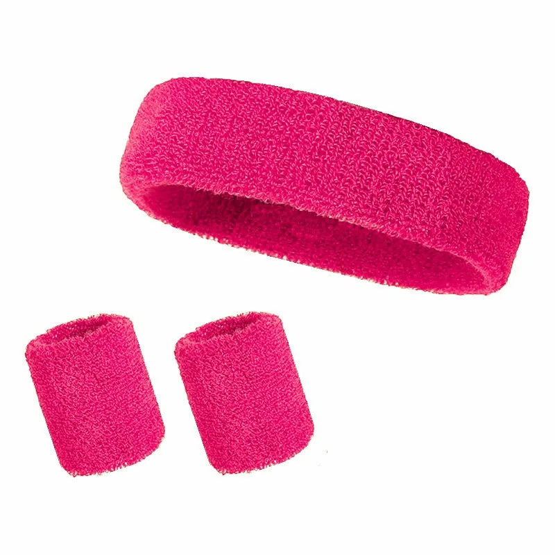 A set of three bright pink athletic sweatbands or hairbands.