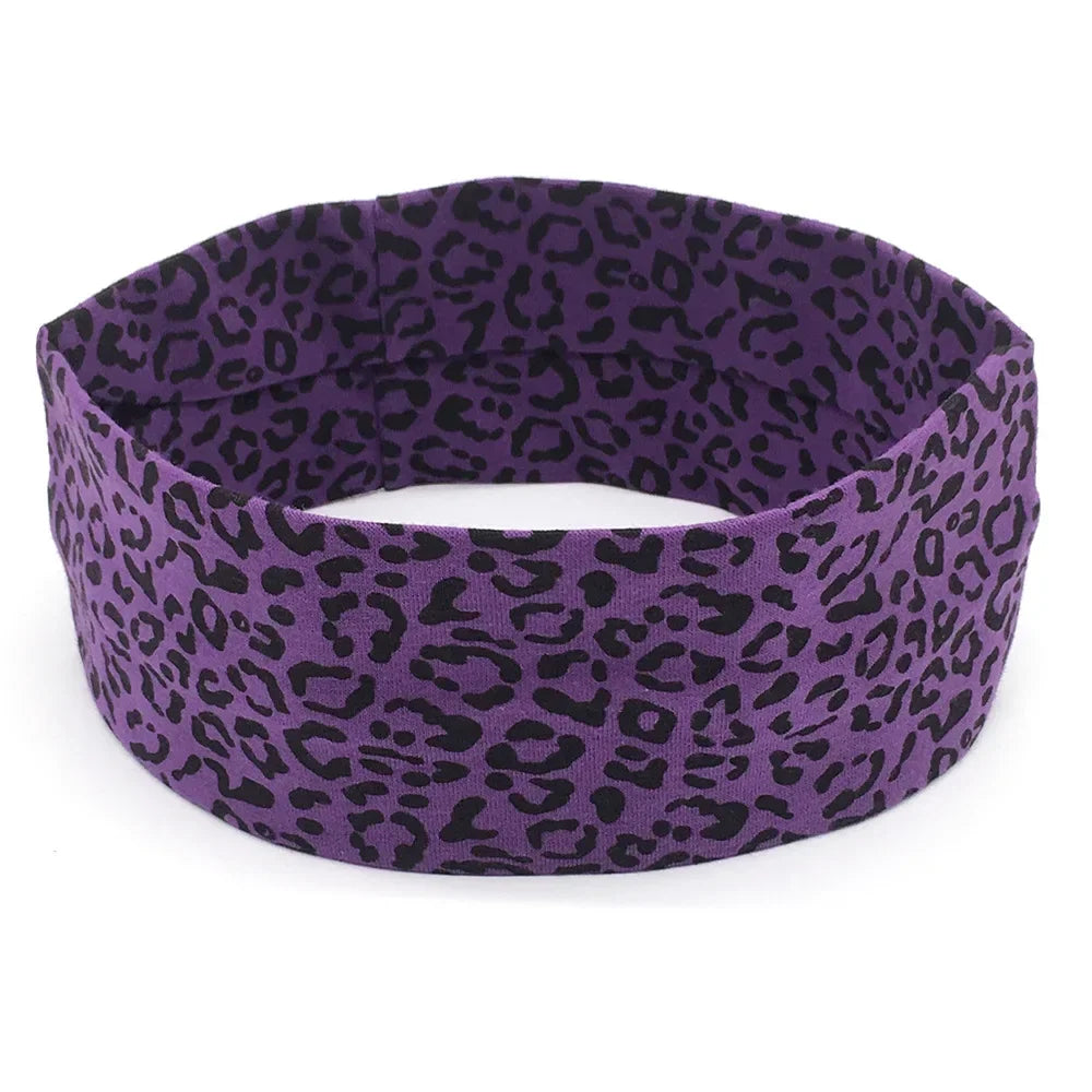 Purple leopard print women's sports headband shown flat