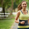 A woman wearing a yellow tank top and black lumbar support belt is jogging outdoors.