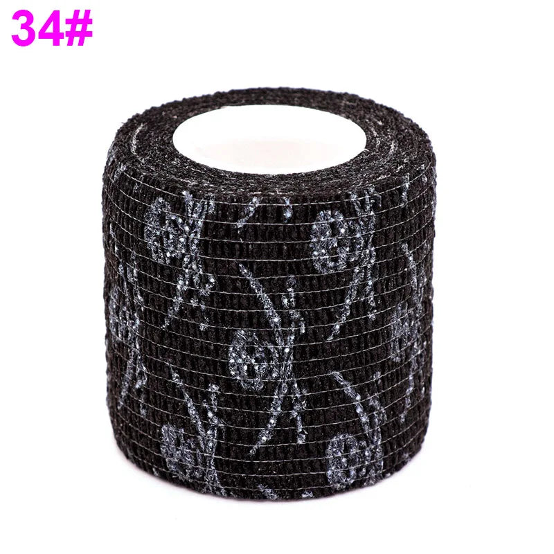 Black elastic bandage tape with a fruit pattern design wrapped around a cylindrical object.