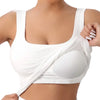 White racerback padded tank top worn by a woman, showing the front view of the sports bra.