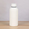 A white double-layer vacuum thermos cup with a black lid sitting on a wooden surface.