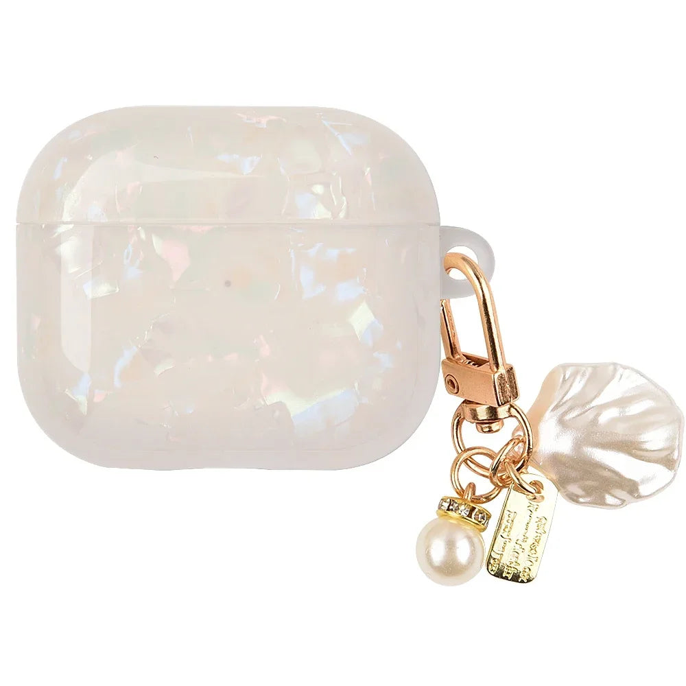 A clear, iridescent leopard print protective case for AirPods Pro with a gold chain and pearl charm.