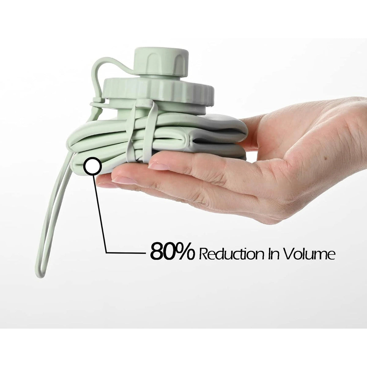 A hand holds a light green collapsible silicone sports water bottle, demonstrating an 80% reduction in volume.