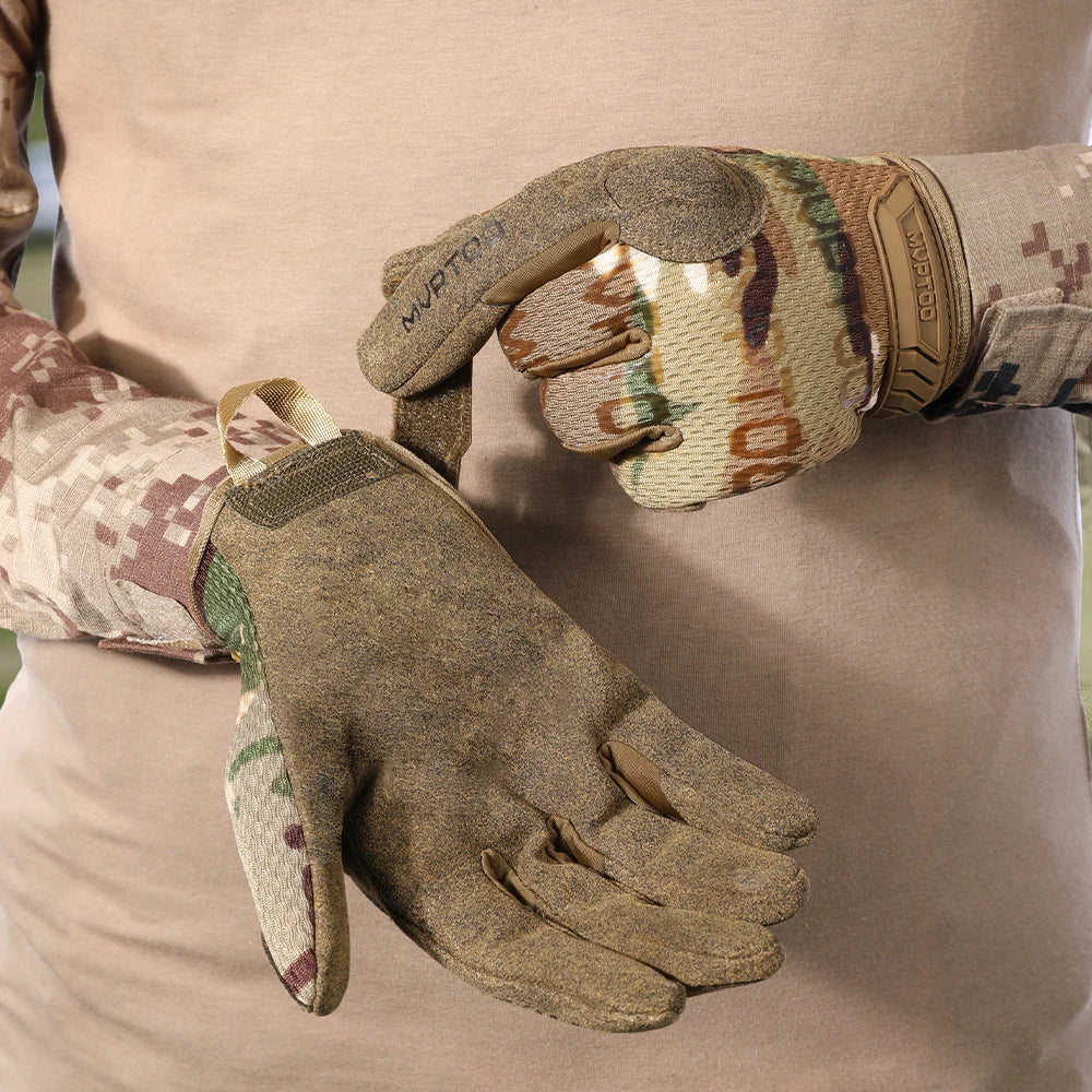 A hand wearing tactical full finger combat gloves is shown against a light colored background.