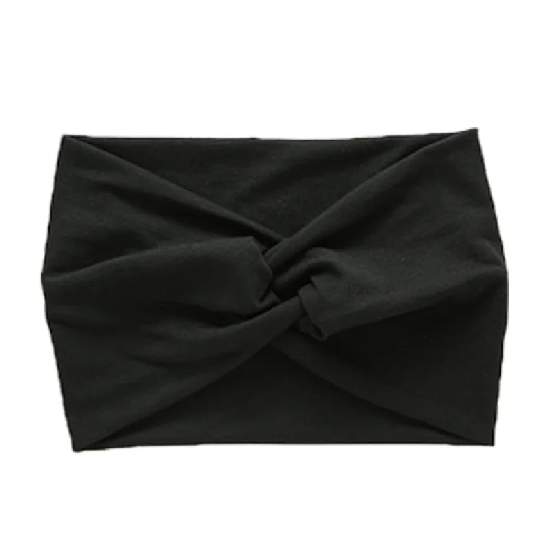 Black women's elastic sports headband folded and displayed flat