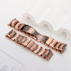 A close-up view of a rose gold copper magnetic bracelet and its packaging.
