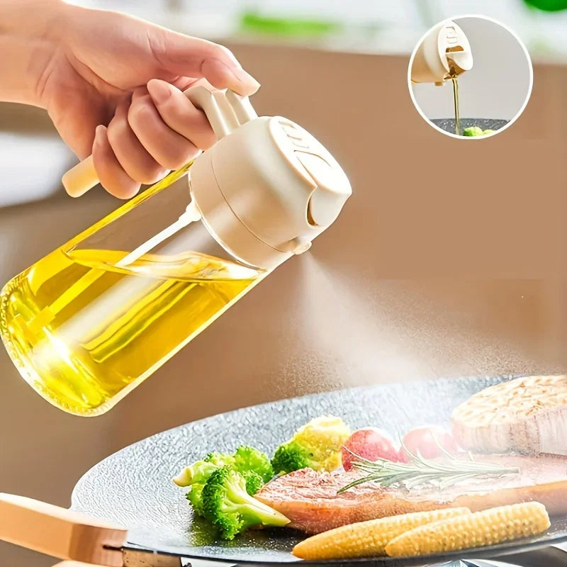 A hand sprays golden olive oil onto food with a glass oil sprayer.