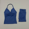 A royal blue women's seamless backless fitness set consisting of a cropped top and matching leggings.